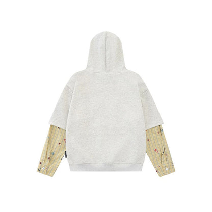 Women's hooded sweatshirt with layered look, kangaroo pocket and playful patch applications EVA-US