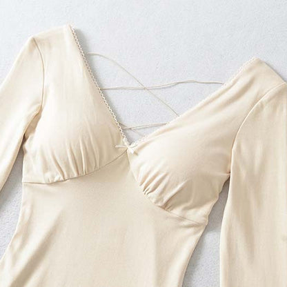 Ladies form-fitting mini dress with a deep V-neckline, gathered bust, and crossed back straps EVA-US