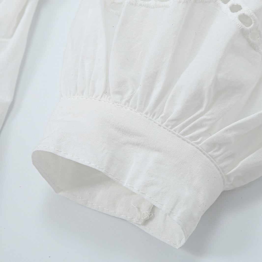 Women's blouse with V-neckline, broderie embroidery, and voluminous puff sleeves EVA-US