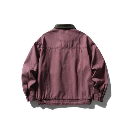 Men's tailored canvas blouson with contrasting leather collar and elastic hem.