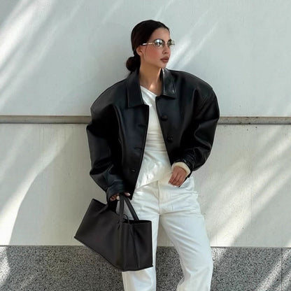 Women's short jacket made of vegan leather imitation in boxy cut with oversized shoulders and hidden button placket EVA-US