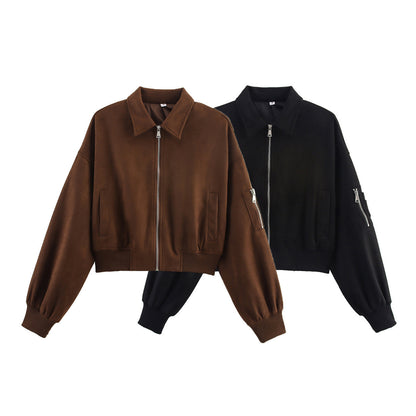 Women's cropped bomber jacket in velour look with shirt collar, sleeve pocket, and fitted ribbed waistband.