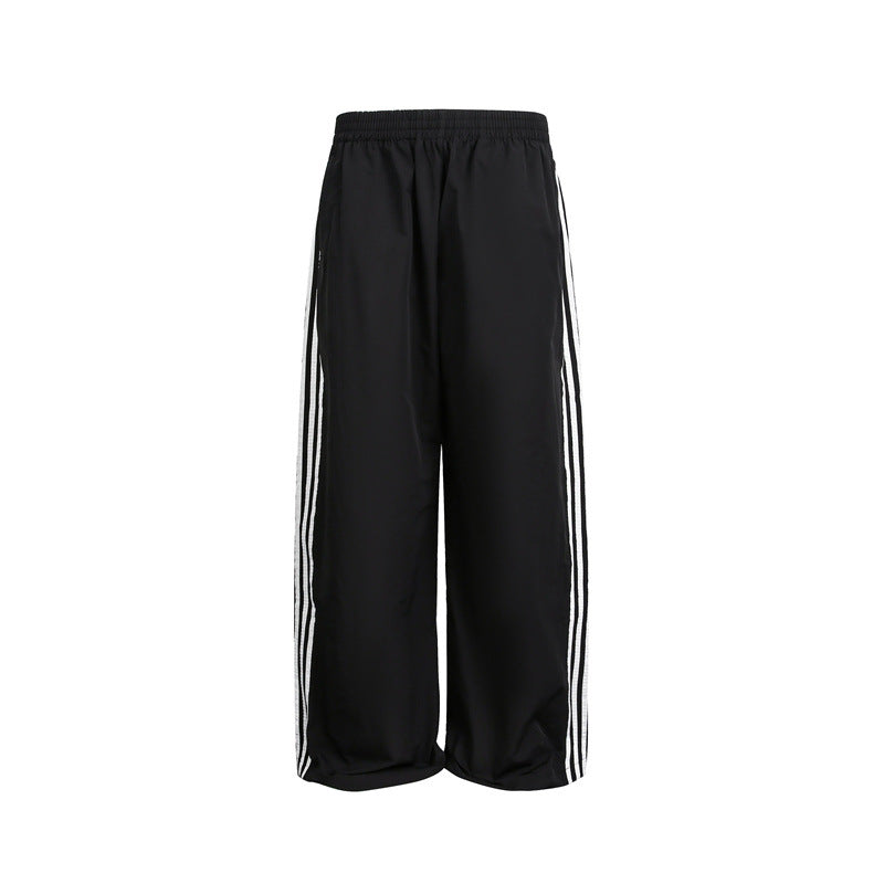 Women's wide satin training pants with elastic waistband and side contrast stripes EVA-US