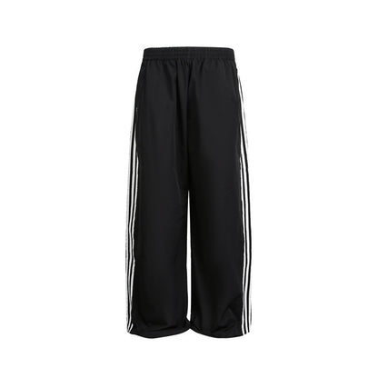 Women's wide satin training pants with elastic waistband and side contrast stripes EVA-US