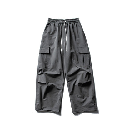 Unisex Wide Cargo Utility Pants in Baggy Cut with Elastic Drawstring and Generous Flap Pockets
