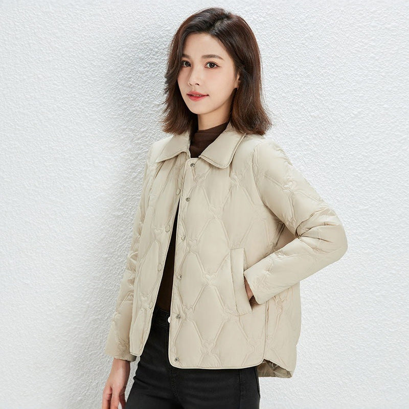 Women Short Cut Quilted Jacket with Decorative Stitching and Rounded Hem EVA-US