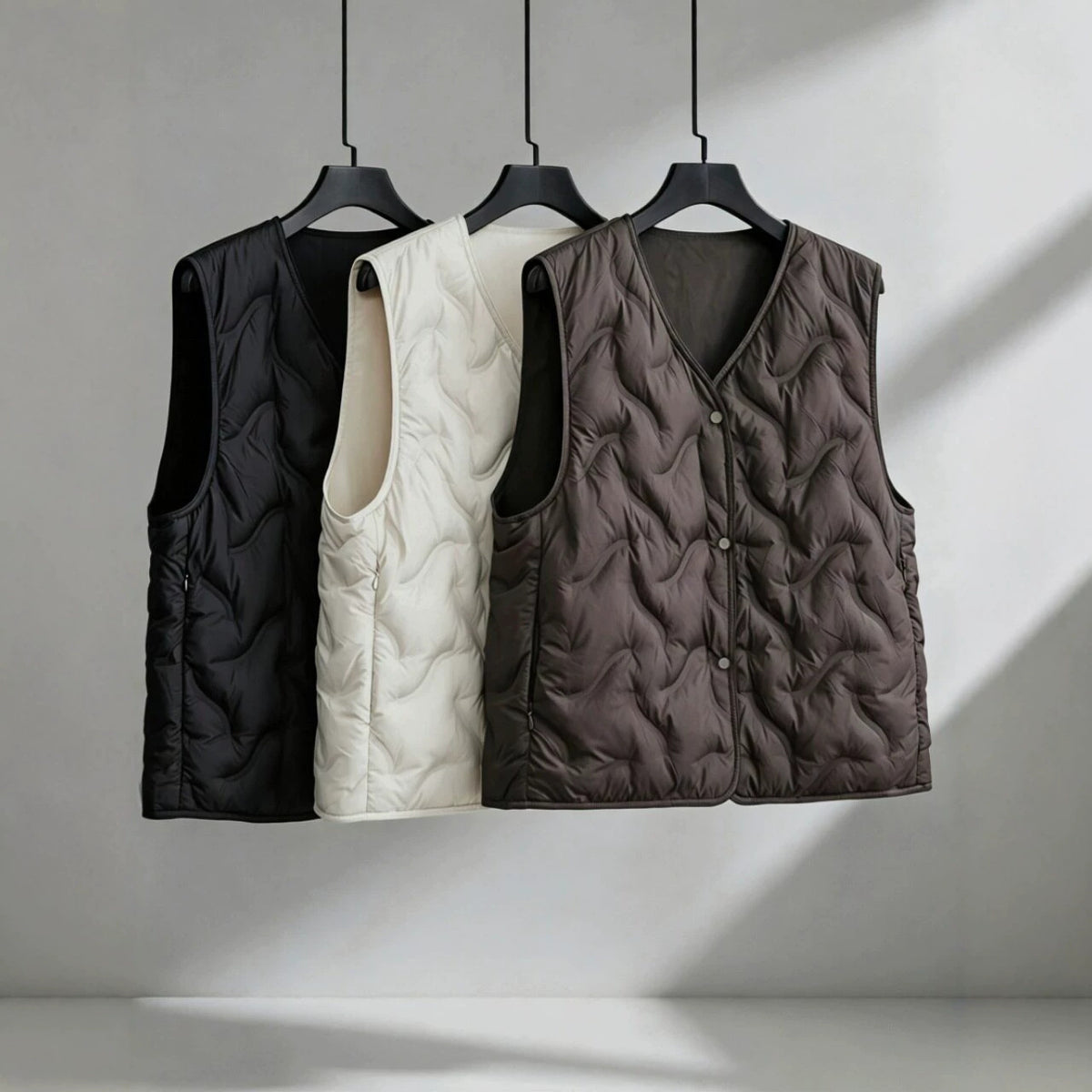 Women’s lightly padded quilted vest with V-neck and press studs EVA-US