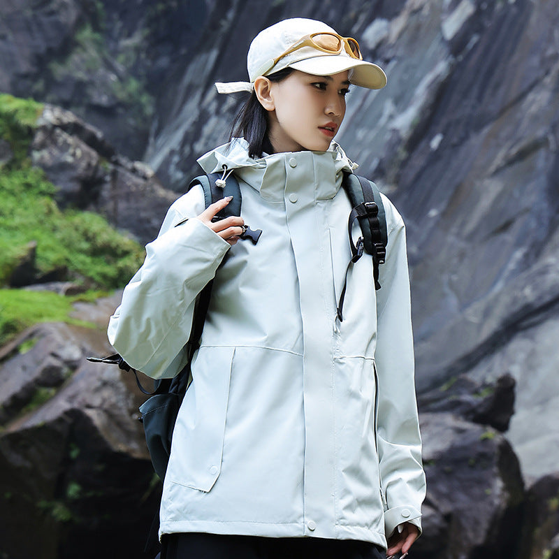 Women’s technical multi-layer hardshell rain jacket with adjustable hood, chest strap, and water-resistant zippers EVA-US