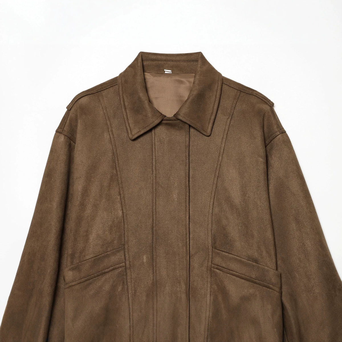 Women's cropped blouson jacket in suede look with shirt collar, epaulettes, and elastic waistband.