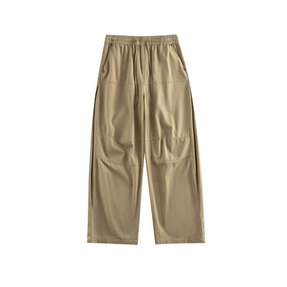Women's wide utility-style culotte pants with elastic waistband, drawstring, and patch pockets.