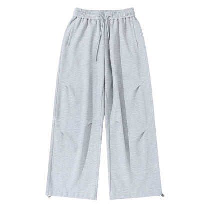 Unisex Wide French-Terry Sweatpants with elastic drawstring waistband, side pockets, and adjustable hem