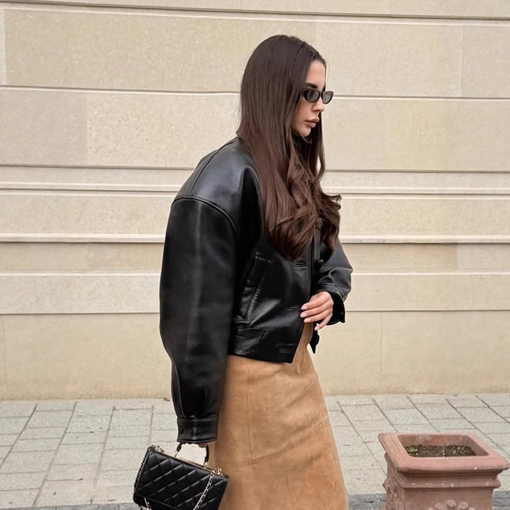 Women's short jacket made of vegan leather imitation in boxy cut with oversized shoulders and hidden button placket EVA-US