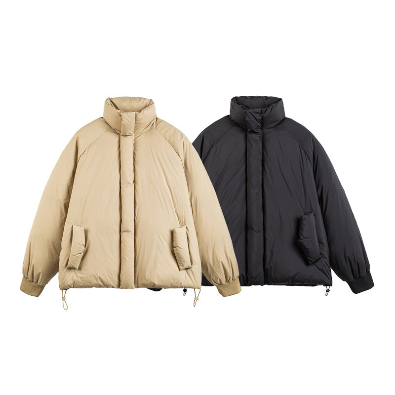 Unisex Boxy-padded short jacket with high stand-up collar, raglan sleeves and drawstring hem EVA-US