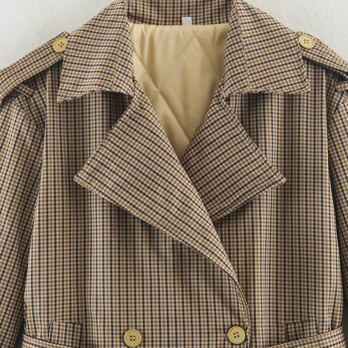 Women's short trench coat in checkered pattern with waist belt, shoulder straps and quilted inner lining EVA-US