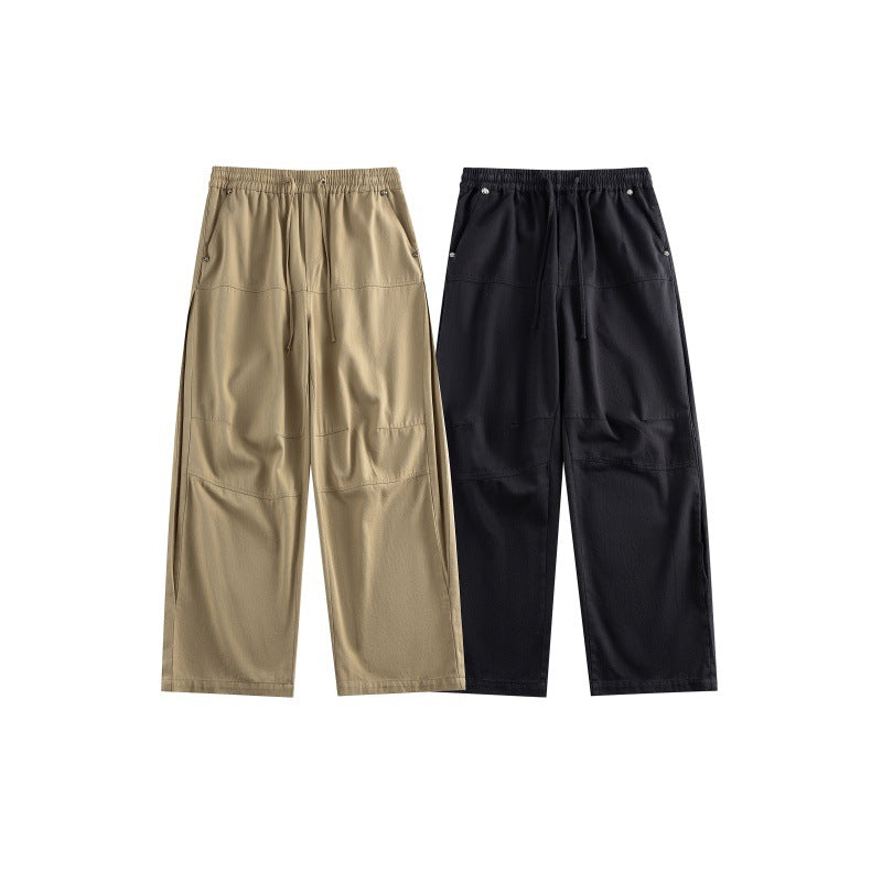 Women's wide utility-style culotte pants with elastic waistband, drawstring, and patch pockets.