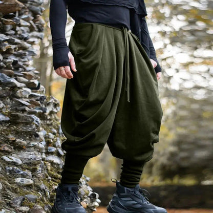 Men's avant-garde harem pants with wrap front, elastic waistband, and narrow lower leg EVA-US