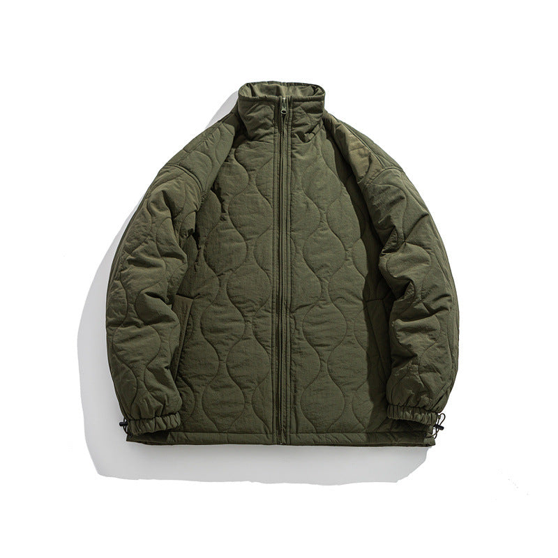 Unisex Boxy quilted jacket in military liner style with high stand-up collar and adjustable hem EVA-US