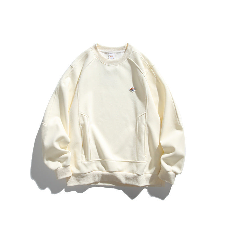 Unisex Oversize Sweatshirt made of French Terry with raglan sleeves, concealed side pockets, and a small logo patch EVA-US