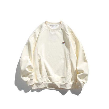 Unisex Oversize Sweatshirt made of French Terry with raglan sleeves, concealed side pockets, and a small logo patch EVA-US