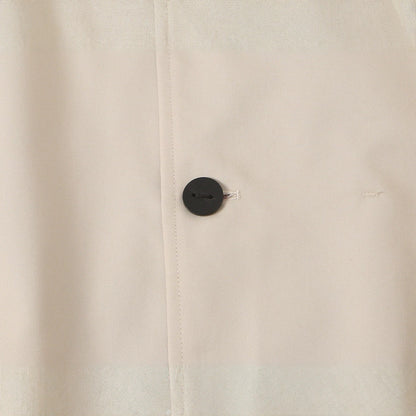 Women's short jacket with high stand-up collar and asymmetrical button placket EVA-US