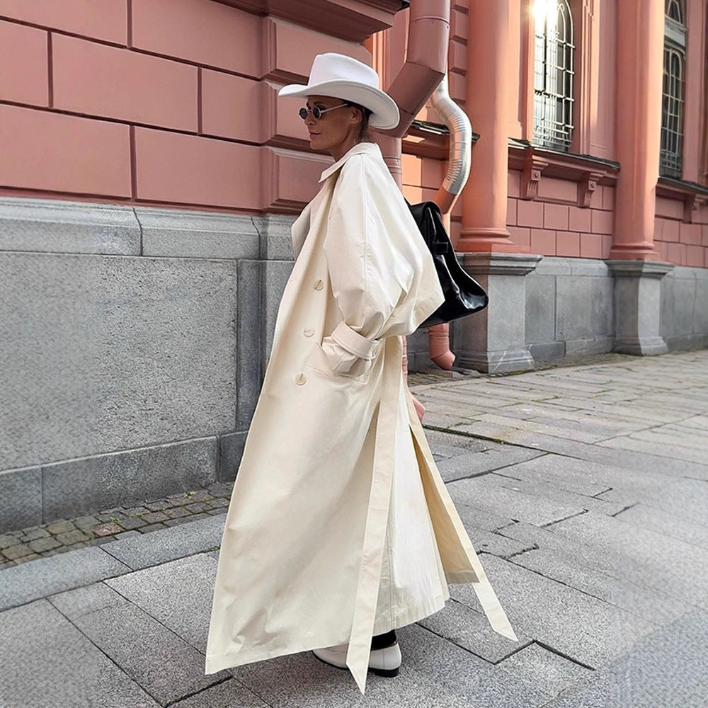 Women's maxilength tailored trench coat made of a light cotton blend with a tie belt EVA-US
