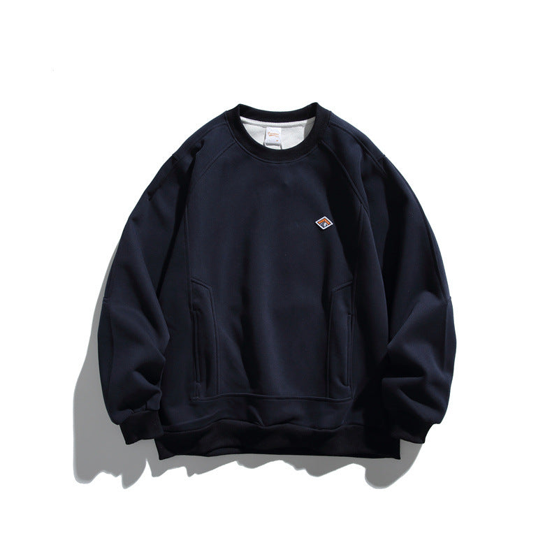 Unisex Oversize Sweatshirt made of French Terry with raglan sleeves, concealed side pockets, and a small logo patch EVA-US