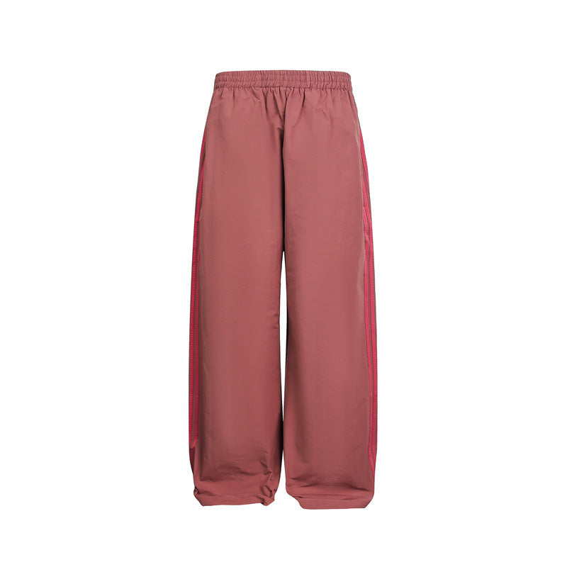 Women's wide satin training pants with elastic waistband and side contrast stripes EVA-US