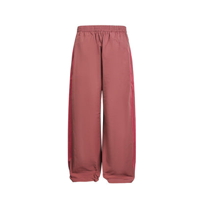 Women's wide satin training pants with elastic waistband and side contrast stripes EVA-US