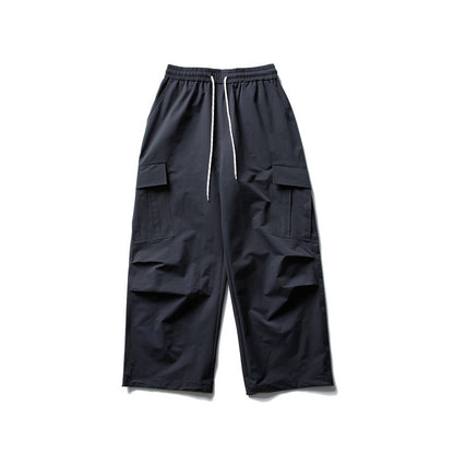 Unisex Wide Cargo Utility Pants in Baggy Cut with Elastic Drawstring and Generous Flap Pockets