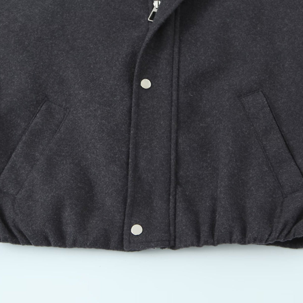 Women's short bomber-style jacket with stand-up collar, snap button placket, and elastic hem EVA-US