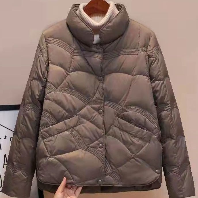 Women's quilted thermal jacket with high collar and decorative wave quilting EVA-US