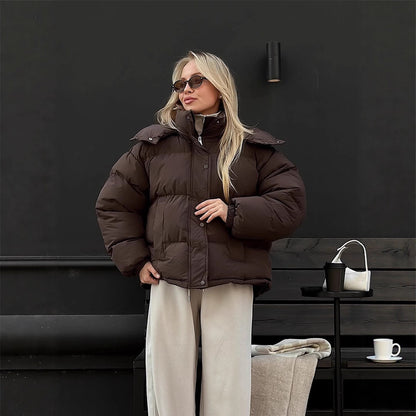 Women's short-cut oversized quilted jacket with high stand-up collar and concealed snap button placket EVA-US