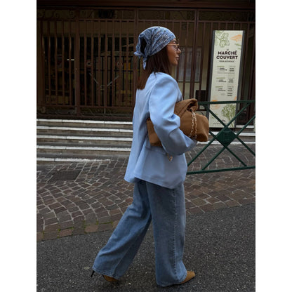 Women’s oversized long blazer with boxy silhouette, soft shoulders, and extended cut.