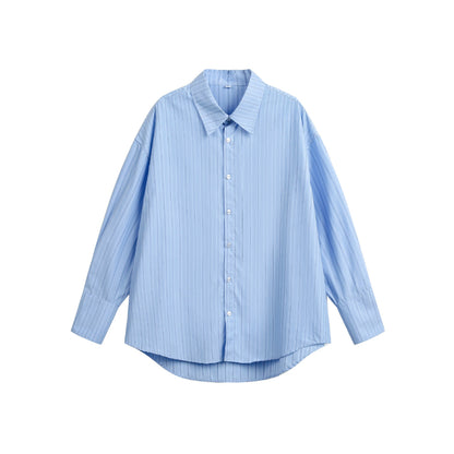 Women's oversized shirt blouse with fine pinstripe texture and rounded hem.