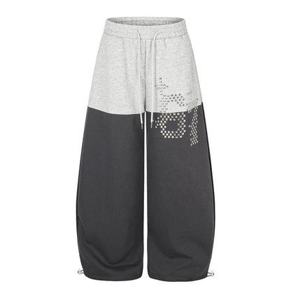 Women's Oversize Two-Tone Palazzo Sweatpants made of French Terry with logo studs, drawstring and adjustable hem.
