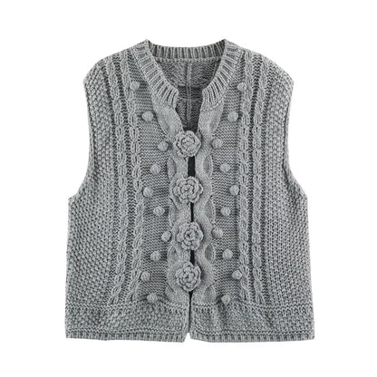Women's knitted vest with cable pattern, flower appliqués and bobble texture EVA-US