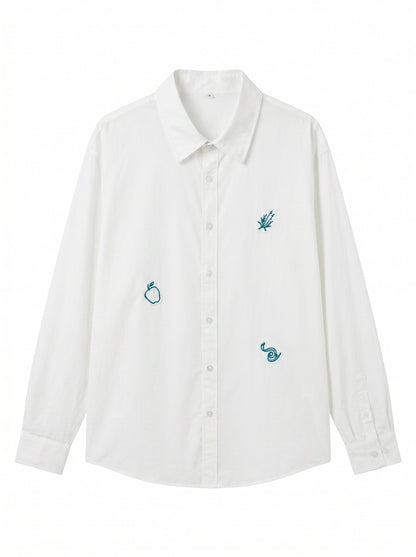 Women's oversized shirt blouse with fine embroidery appliqués and elongated hem down