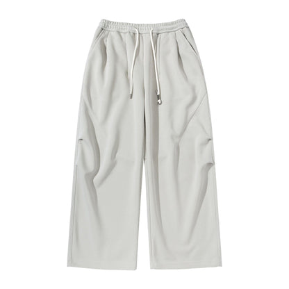 Women's Wide Cropped Jogging Pants made of French Terry with a high elastic waistband, drawstring, and side pockets EVA-US