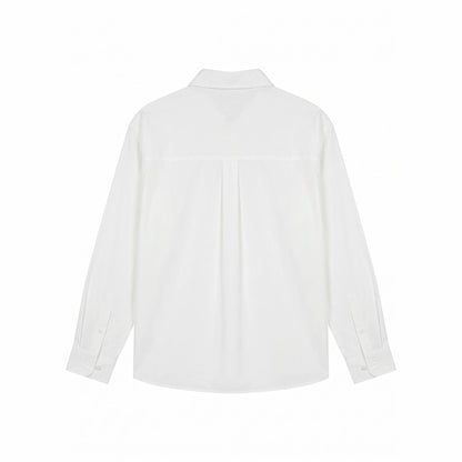 Women's oversized shirt blouse with fine embroidery appliqués and elongated hem down