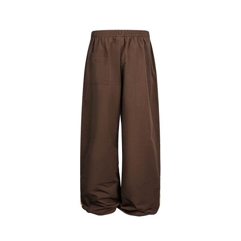 Women's wide satin training pants with elastic waistband and side contrast stripes EVA-US
