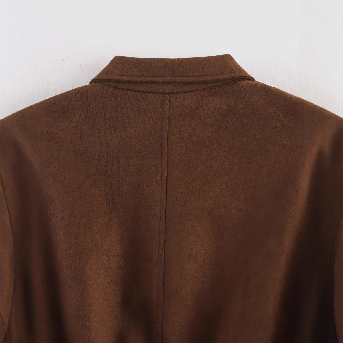 Women's cropped bomber jacket in velour look with shirt collar, sleeve pocket, and fitted ribbed waistband.