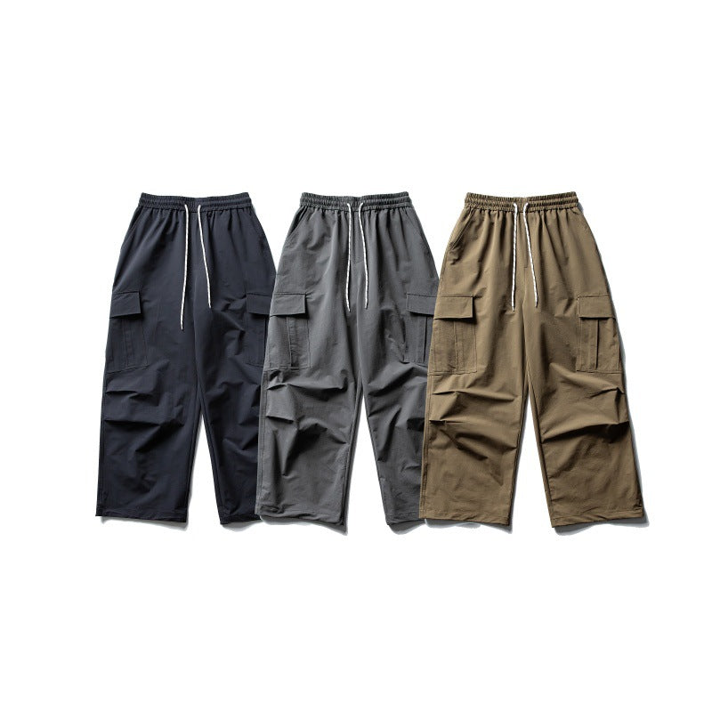 Unisex Wide Cargo Utility Pants in Baggy Cut with Elastic Drawstring and Generous Flap Pockets
