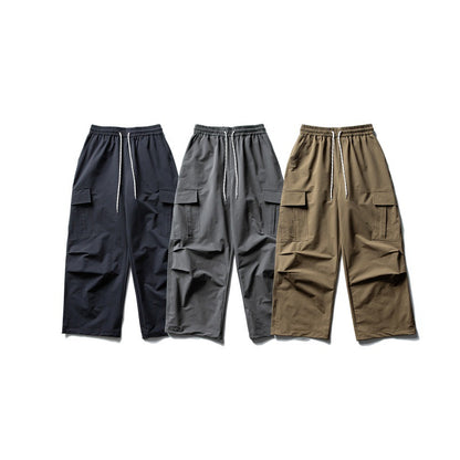 Unisex Wide Cargo Utility Pants in Baggy Cut with Elastic Drawstring and Generous Flap Pockets