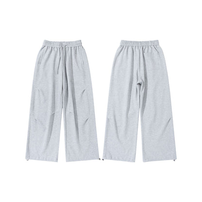 Unisex Wide French-Terry Sweatpants with elastic drawstring waistband, side pockets, and adjustable hem