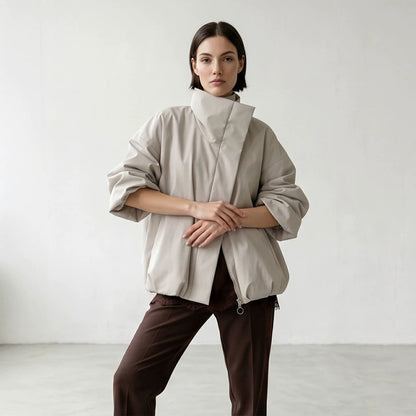 Women's boxy short quilted jacket with high asymmetric stand-up collar EVA-US