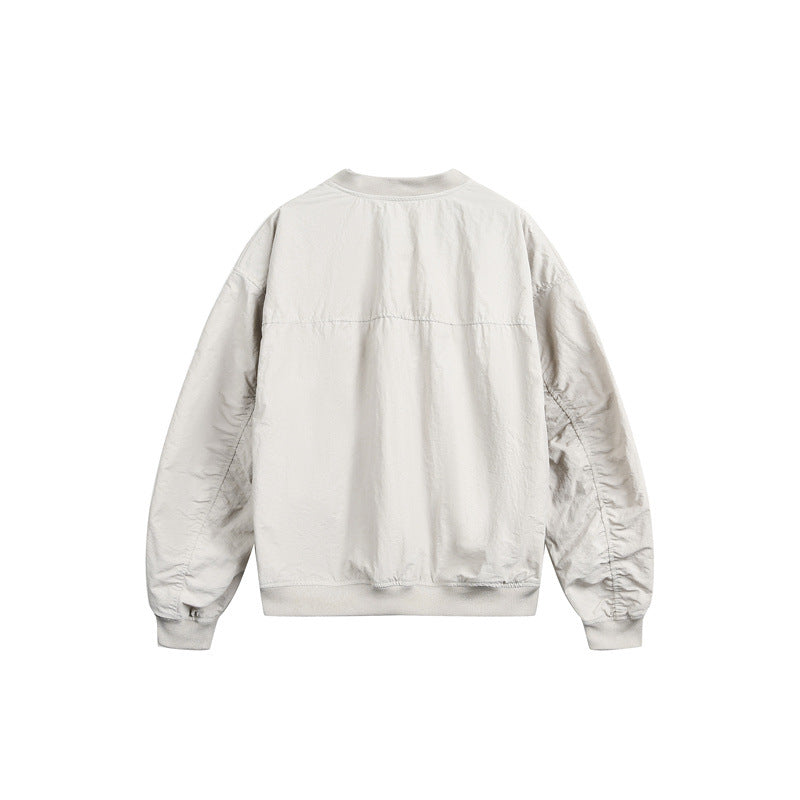 Unisex short cut lightweight nylon bomber jacket with utility pockets and ribbed hem EVA-US