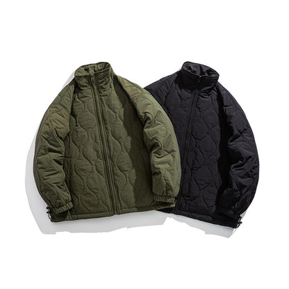 Unisex Boxy quilted jacket in military liner style with high stand-up collar and adjustable hem EVA-US