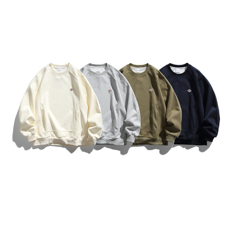 Unisex Oversize Sweatshirt made of French Terry with raglan sleeves, concealed side pockets, and a small logo patch EVA-US