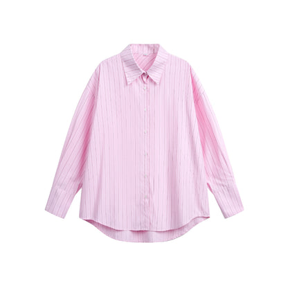 Women's oversized shirt blouse with fine pinstripe texture and rounded hem.