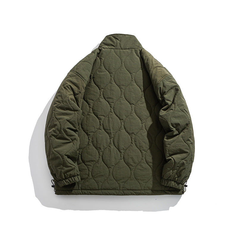 Unisex Boxy quilted jacket in military liner style with high stand-up collar and adjustable hem EVA-US